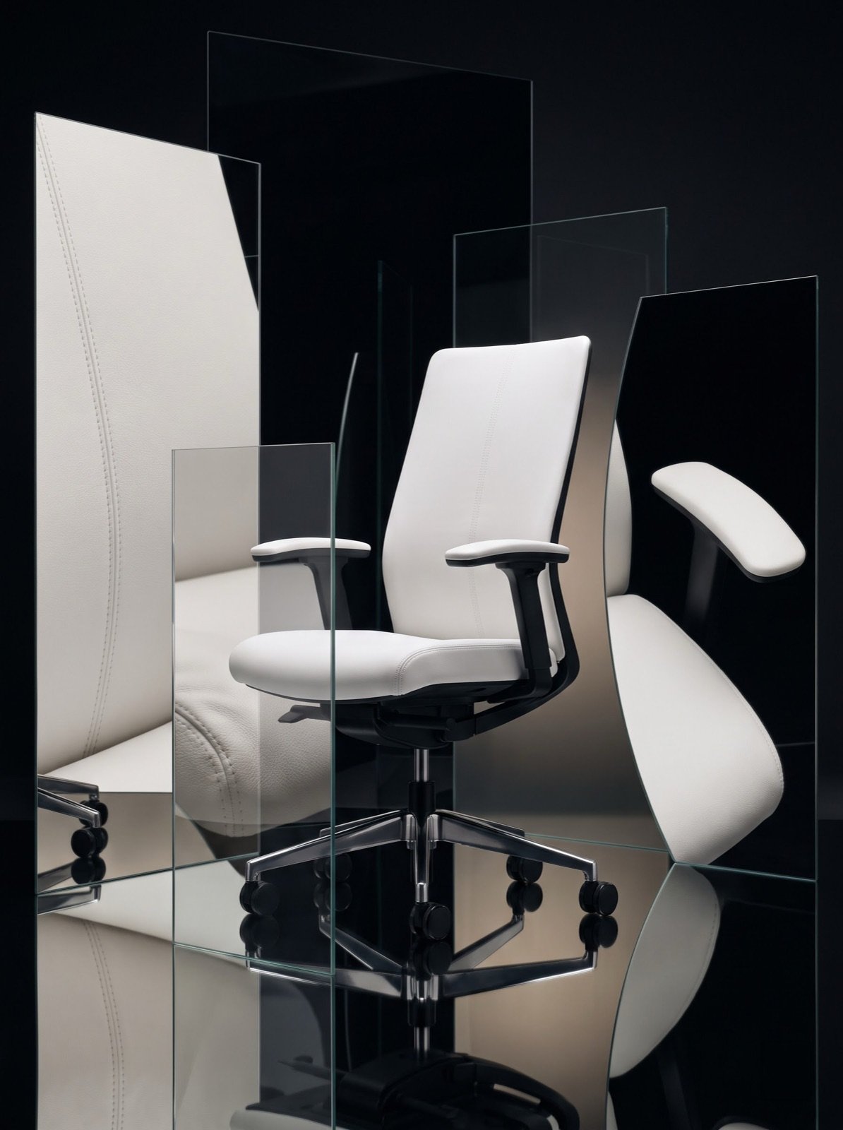 Chair studied through overlapping glass panels showing stitch and material detail